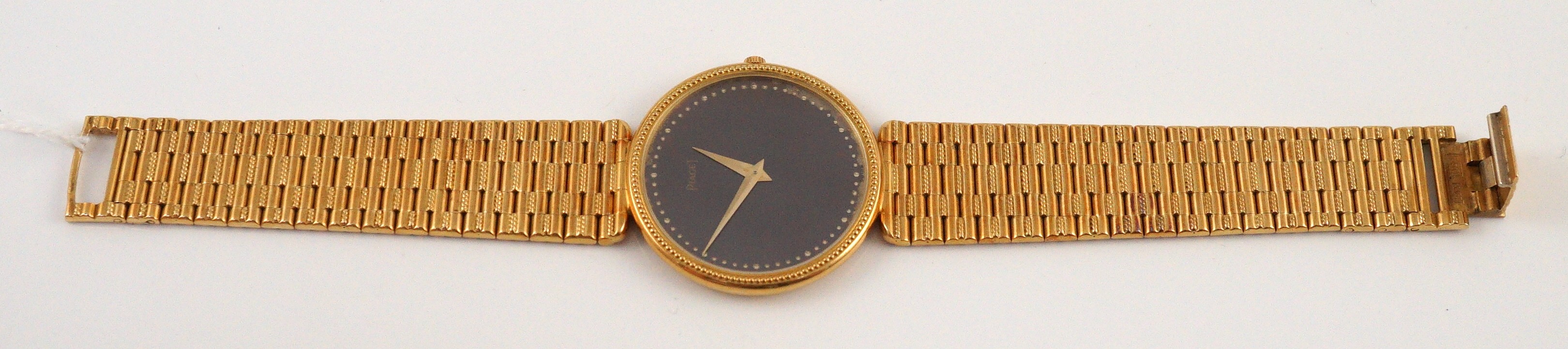 A gentleman's 18ct gold Piaget manual wind dress wrist watch, on an 18ct gold Piaget bracelet